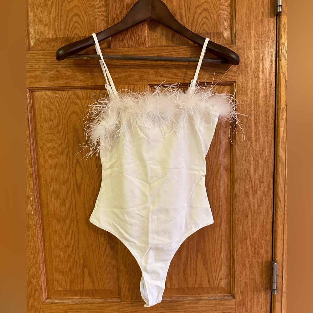 White feathered body suit. Size small